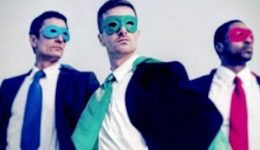 BAM Agency Three men in suits strike superhero poses against a neutral background. They wear colorful masks and capes—one in blue, another in green, and the third in red. With determination and confidence, theyre ready to tackle marketing tips for reaching millennials. BAM Agency