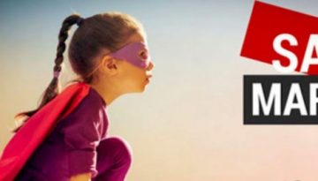 BAM Agency A child in a superhero costume and red cape crouches against a blurred background, embodying the daring spirit of the Savage Marketing 2018 event. This bold marketing experience captures the essence of innovation and creativity. BAM Agency