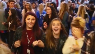 BAM Agency A large crowd of excited young people, mostly women, are gathered closely together at the successful Freshers campaign. Some are smiling and holding phones, capturing the lively atmosphere. The background shows more individuals mingling in a bustling environment. BAM Agency