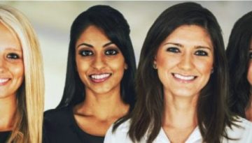 BAM Agency A group of six women, all smiling, stand side by side, embodying millennial thinking. They have diverse appearances and are dressed in professional attire. The blurred indoor setting accentuates their modern approach to millennial recruitment. BAM Agency
