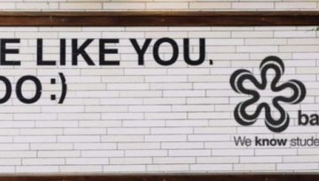 BAM Agency A white brick wall features street art reading WE LIKE YOU. TOO ;) alongside a stylized flower logo and the text bam® We know students. Framed by wood, with greenery above, this piece invites you to become a BAM Influencer in their exciting marketing journey. BAM Agency