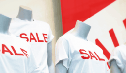 BAM Agency Mannequins clad in white t-shirts emblazoned with SALE in bold red letters take center stage, perfect for budget marketing. The backdrop features a striking red and white sale sign designed to capture the attention of savvy student shoppers. BAM Agency