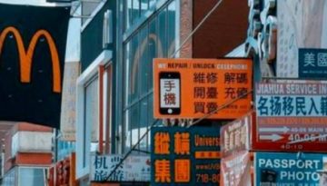 BAM Agency A bustling urban street teems with vibrant storefronts and colorful signs in Chinese script. Amidst the saturated market, a prominent McDonald’s logo stands out alongside other business advertisements, each striving to find its niche in the lively scene. BAM Agency