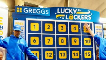 BAM Agency Two people in blue Greggs uniforms stand beside the Lucky Lockers game board, numbered 1 to 12. Perfect for advertising at university campuses and Freshers Fairs, signs offer a free sandwich for new app sign-ups. They smile and pose with arms raised, engaging passersby effortlessly. BAM Agency