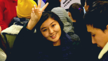 BAM Agency Amid the buzz of an international youth marketing agency event, a lively group gathers indoors, exchanging smiles and flashing peace signs. Some sport cozy winter jackets and scarves as they mingle against a backdrop of animated conversations. BAM Agency