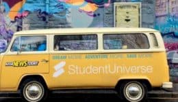 BAM Agency A vintage yellow van with StudentUniverse branding is parked in front of a vibrant, colorful mural with abstract and graffiti art, echoing the lively energy of the Aussie News Today Tour and adding a dynamic urban vibe to the scene. BAM Agency